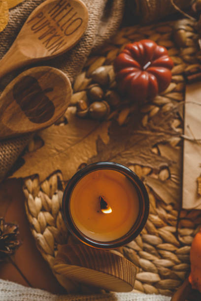istock Burning candle in a cozy warm homey autumn atmosphere 2194577510
