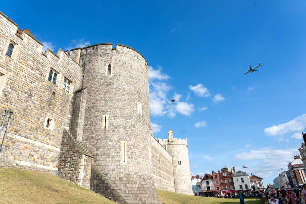Windsor Castle, Berkshire, United Kingdom, September 20, 2024. Royal residence, palace. View towards Henry VIII gate to the Lower Ward,  just off Castle Hill street. Incidental people. Overcast autumn day outdoors