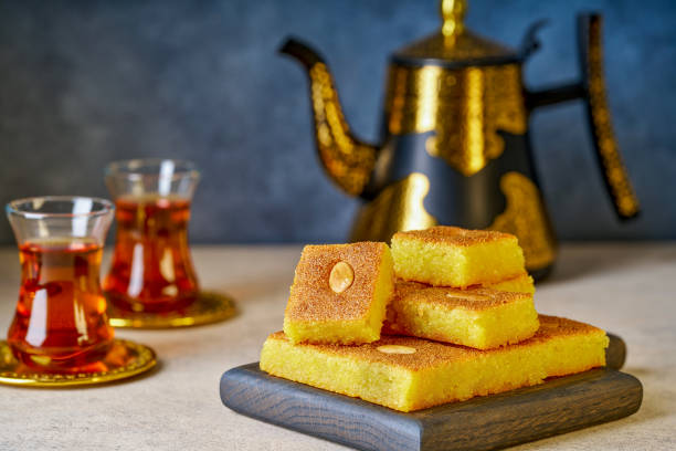 istock Middle eastern traditional semolina cake basbousa , namoora, hareesa served with tea 2194580743