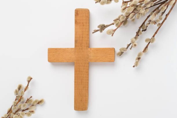 istock Cross with willow branches on wooden background, top, view. Palm Sunday concept 2194587181