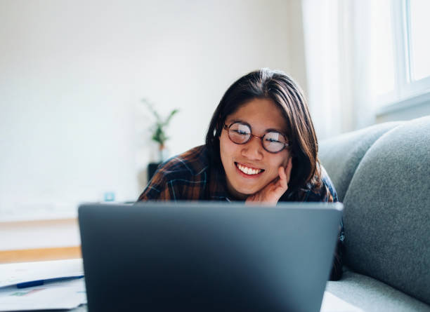 istock Happy Person Using Laptop at Home, Relaxing and Smiling 2194594925