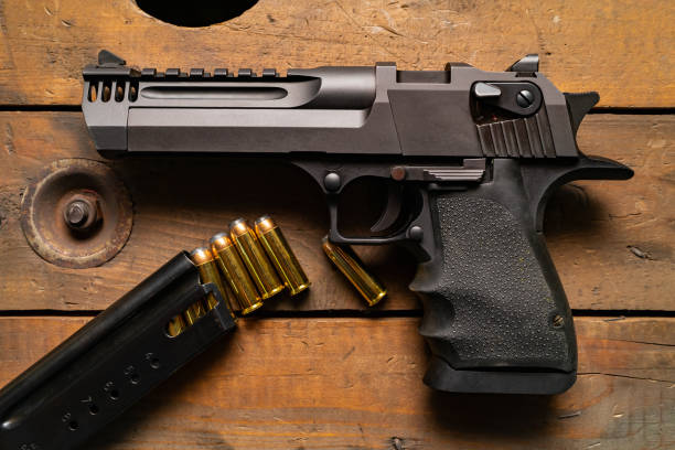 istock Tactical powerful Magnum 44 caliber pistol and cartridges. 2194595339