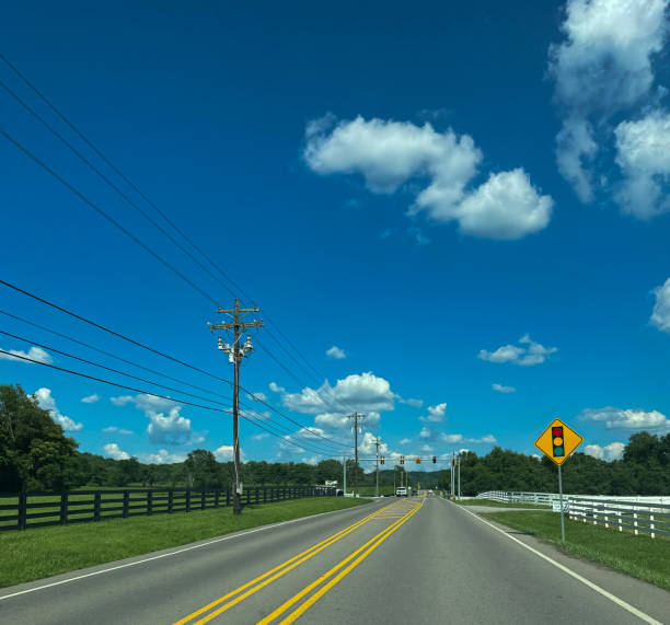 istock Country Road With A Blue Sky 2194596598