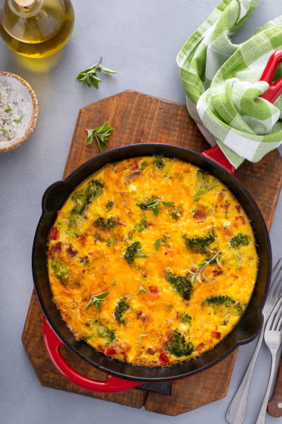 istock Healthy frittata or quiche with broccoli and red pepper whole in a cast iron pan 2194599328