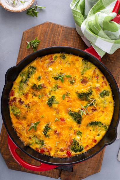 istock Healthy frittata or quiche with broccoli and red pepper whole in a cast iron pan 2194599337