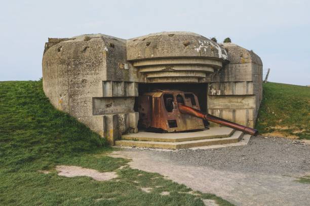istock Old WWII bunker with rusted cannon in Normandy. 2194600553