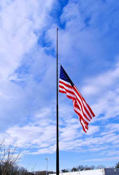istock United State Flag at Half Staff 2194602270