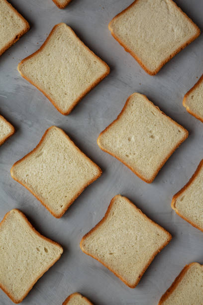 istock Sliced Whole Wheat White Bread on a gray background, top view. Flat lay, overhead, from above. 2194603371