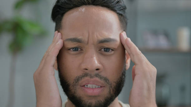 istock Close up of Hispanic Man with Headache 2194608448