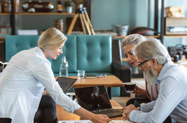 istock Mature Business Executives in Productive Bistro Meeting 2194609126
