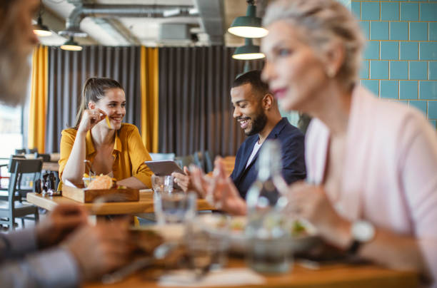 istock Cheerful Young Adults Dining in Modern Bistro 2194609171