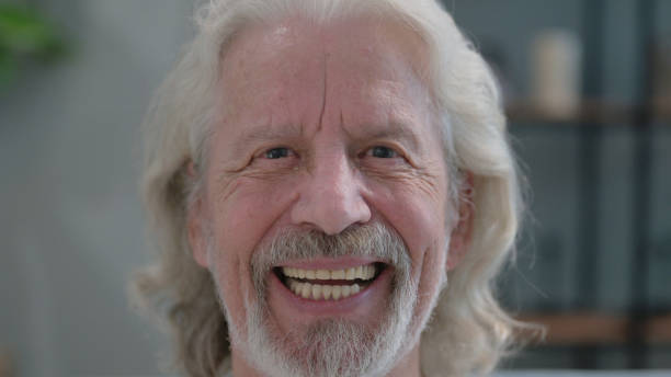 istock Close up of Old Man Smiling at Home 2194609247