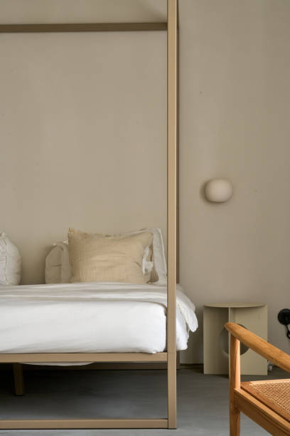 Modern minimalist bedroom interior with beige tones and natural materials