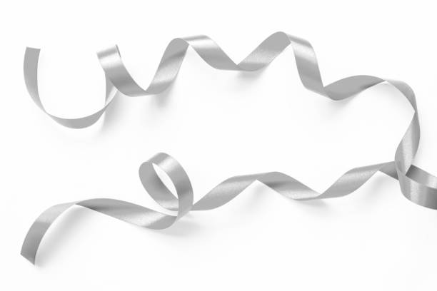 istock Silver ribbon satin bow curly scroll set isolated on white background with clipping path for Christmas and wedding card confetti design decoration 2194617822