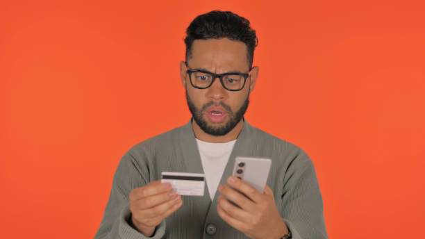istock Casual Hispanic Man Facing Shopping Failure on Red Background 2194620751