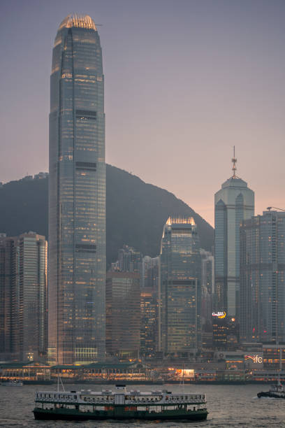 Hong Kong Island; China - June 20, 2007: View of skyscrapers and International Financial Centre on Hong Kong Island from Kowloon at dusk