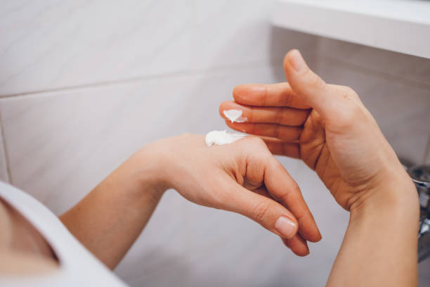 istock Applying hand cream, Skin care. 2194621871
