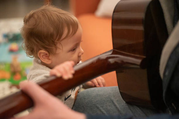 Little boy playing electric guitar.