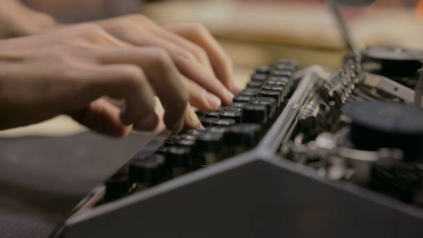 istock Close up of Fingers Typing on Typewriter in Office 2194624078