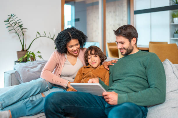 istock Multiracial Family Enjoying Smart Home Technology Together 2194629787