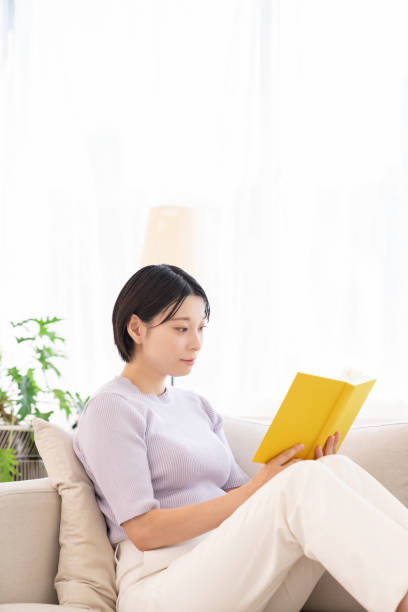 istock asian woman who reads a book, 2194632098