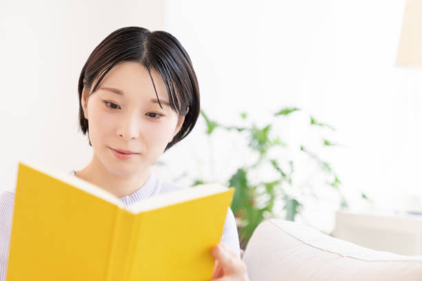 istock asian woman who reads a book, 2194632157