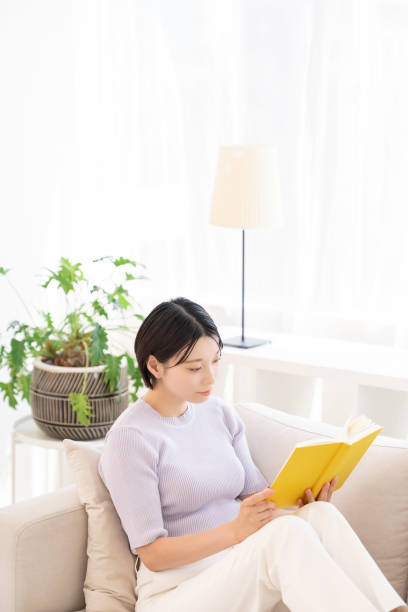 istock asian woman who reads a book, 2194632169