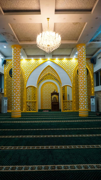 istock Elegant Mosque Interior with Chandelier and Green Carpets 2194632225