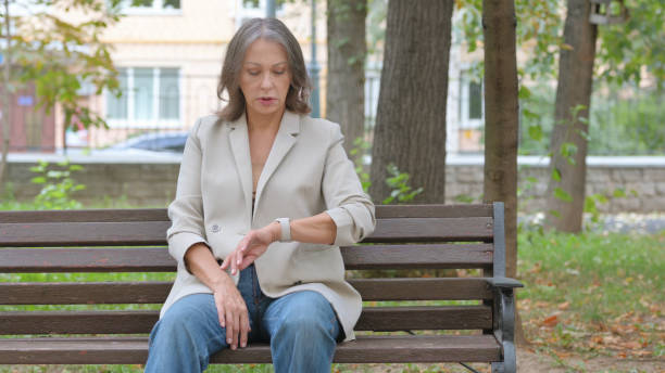 istock Waiting Old Senior Woman Sitting in Park 2194634285