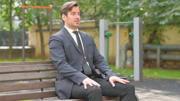 istock Young Businessman Coming and Sitting Outdoor 2194636183