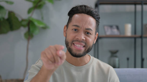 istock Portrait of Angry Hispanic Man Going Crazy 2194636640