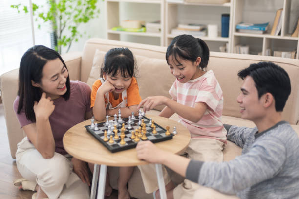 istock Young Asian family at home 2194637408