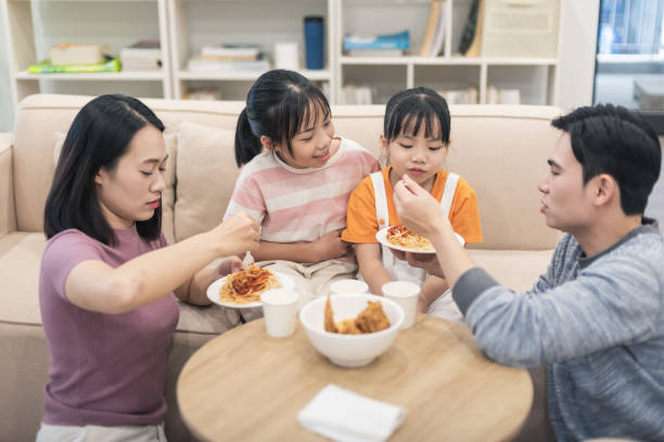 istock Young Asian family at home 2194637450