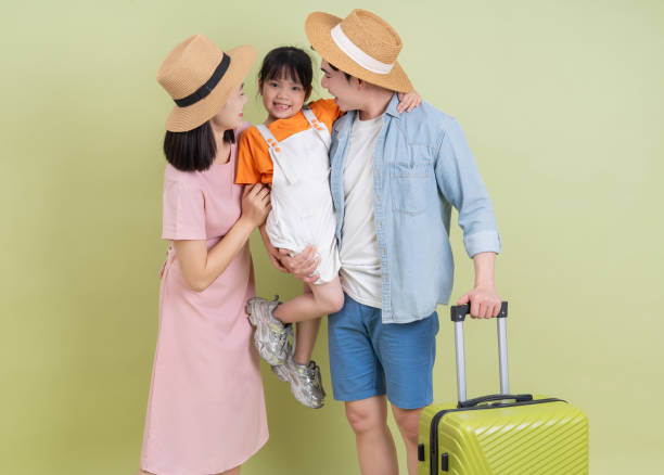 istock Young Asian family on green background 2194637629