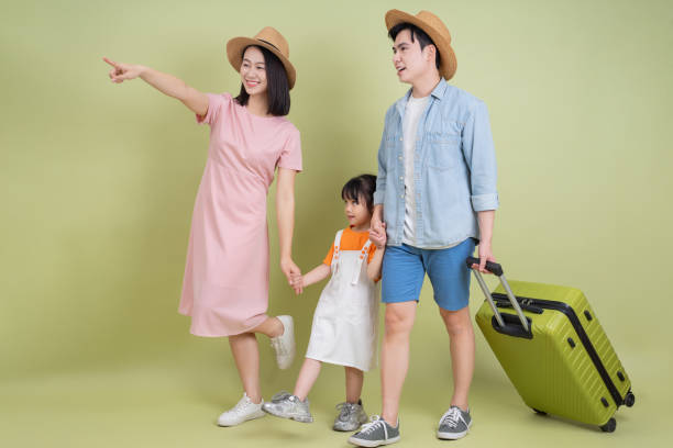 istock Young Asian family on green background 2194637636
