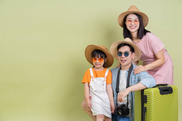 istock Young Asian family on green background 2194637689