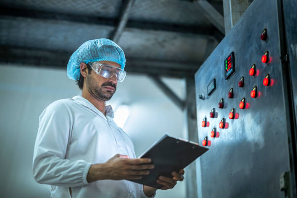 istock Engineer conducting equipment maintenance checks in a clean food processing plant Ensuring quality standards and operational efficiency in an industrial setting. 2194643815