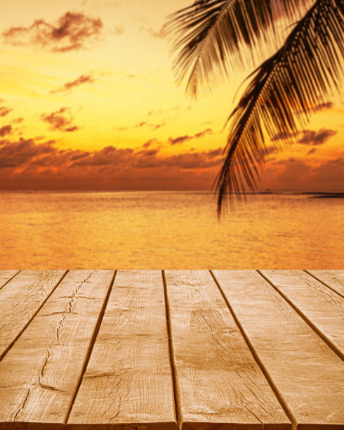 istock Empty wooden table top with tropical ocean sunset background 2194645074