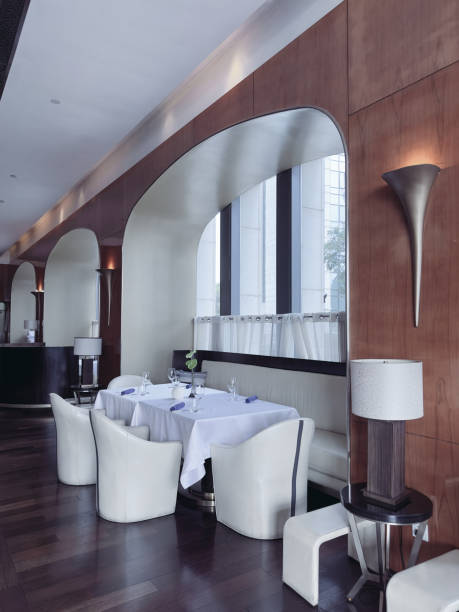 istock A high-end restaurant interior with neatly set tables draped in white tablecloths 2194651381