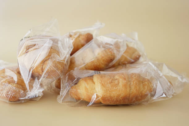 A delightful assortment of packaged croissants beautifully piled together on a surface