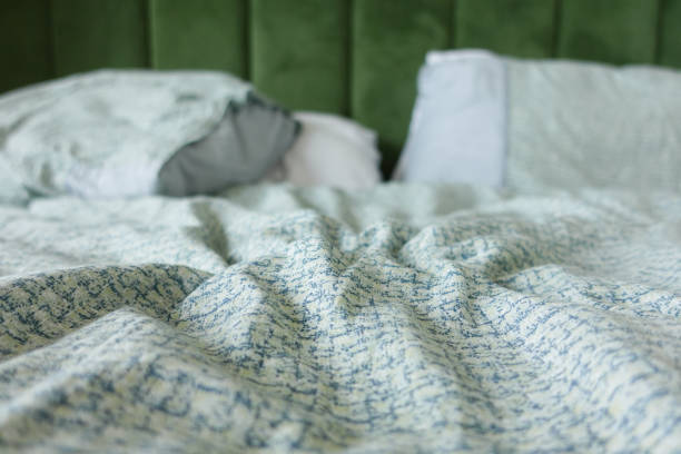 istock messy bed in early morning , messy bed after waking up 2194655909