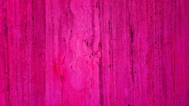 textured travertine stone wall with a pink background, ideal for creating a classic and elegant ambiance in design projects, background for timeless, sophisticated aesthetic.