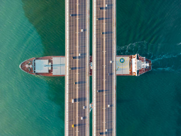 istock Cargo ship passing under bridge traffic at Istanbul Bosphorus 2194662380
