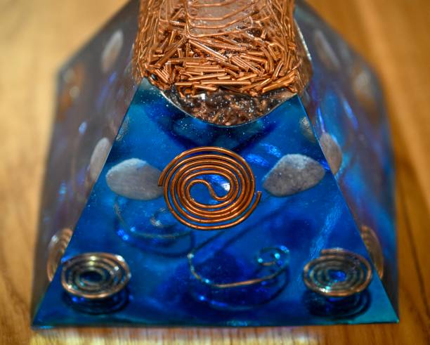 istock High resolution image of a single isolated beautiful one of a kind hand made Orgone pyramid generator containing powerful crystals 2194663389