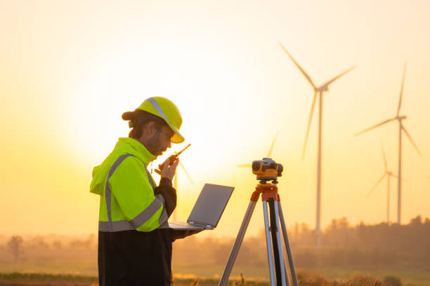 istock Engineer working on laptop checking wind turbines of the field. 2194663864