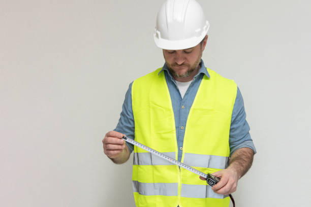 istock builder demonstrating tape measure on white background 2194664203