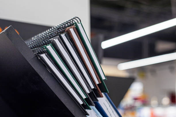 istock notebooks and a notebook on a shelf in a stack. Education and culture 2194665285
