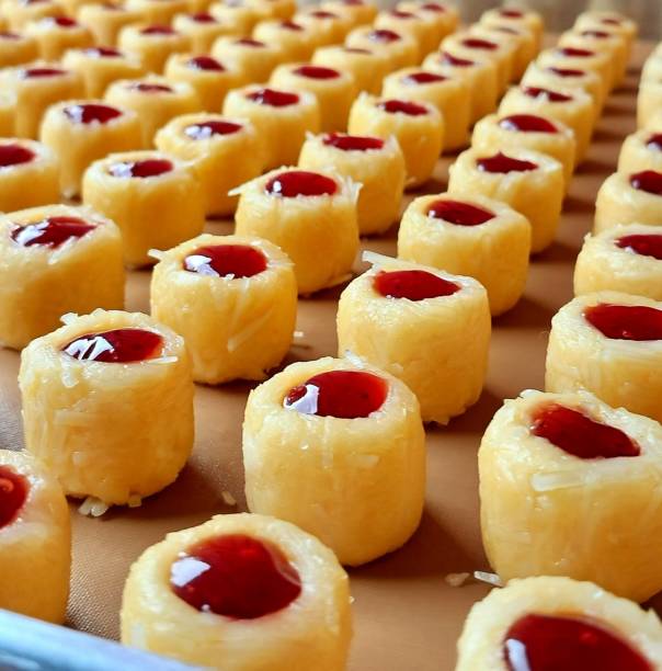 Buttery strawberry thumbprint cookies with a soft, crumbly texture and a sweet strawberry jam center. A delightful treat perfect for tea time or festive occasions.