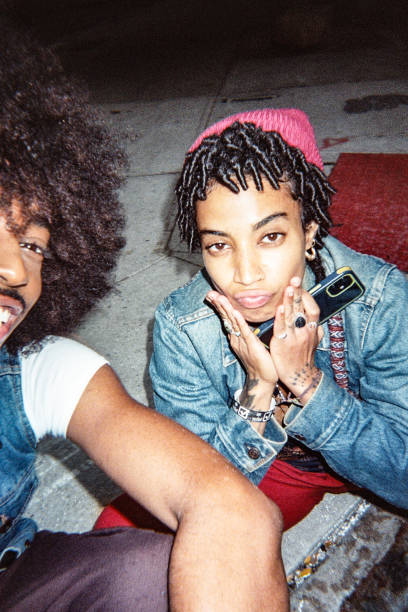 istock Two friends take a selfie, shot on disposable camera 2194667848