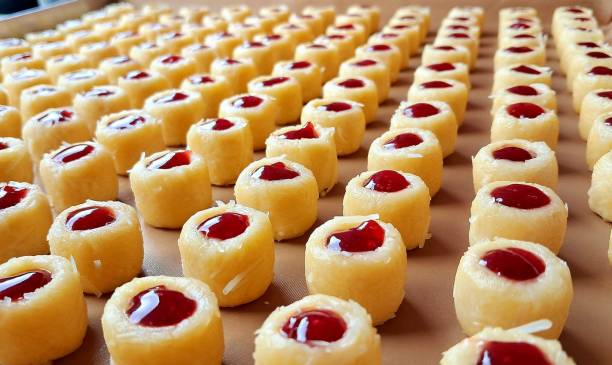 Buttery strawberry thumbprint cookies with a soft, crumbly texture and a sweet strawberry jam center. A delightful treat perfect for tea time or festive occasions.